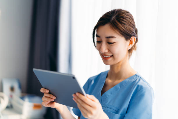 istock Asian dentist using digital tablet in clinic. 1316588563