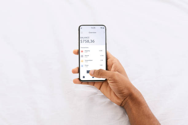 istock African american man using financial app on smartphone 1316589196