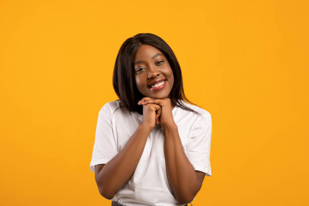 istock Sweet black lady showing tenderness on yellow 1316590809