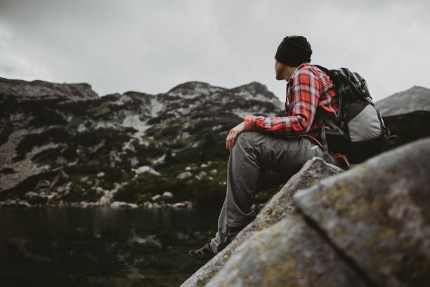 istock Exploring lake in the mountains  at overcast weather 1316590845