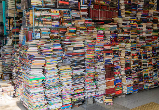 Bangkok, Thailand - May 5, 2021 : Second hand books on shelf in the old store at Chatuchak market