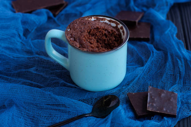 istock a chocolate cupcake in a mug is cooked in the microwave. 1316597387