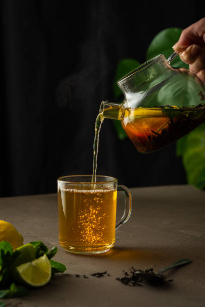 istock Woman pouring hot black tea 1316597669