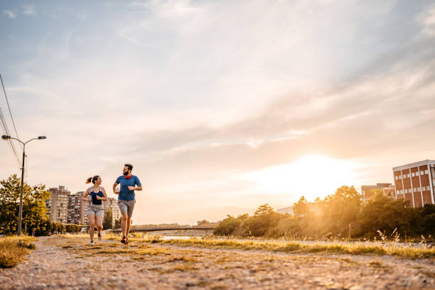 istock Young couple running together 1316598878