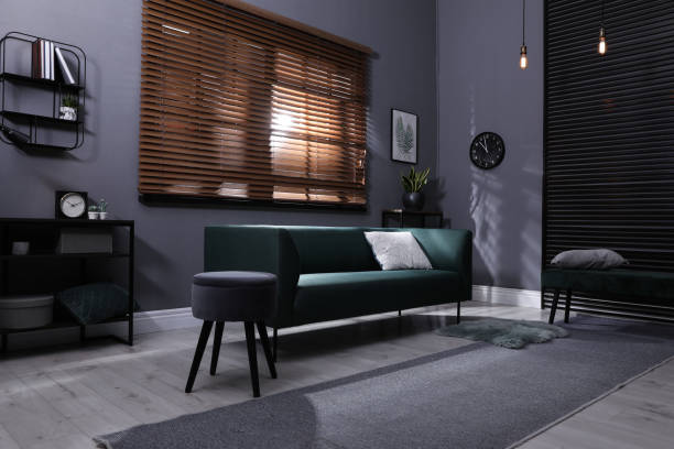 istock Stylish living room interior with comfortable green sofa and cushion 1316598903