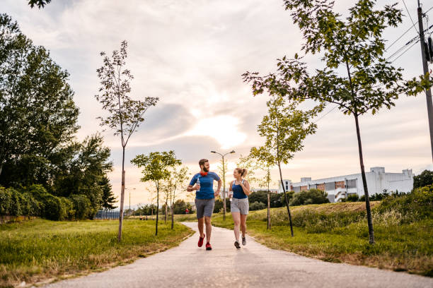 istock Young couple running together 1316599066
