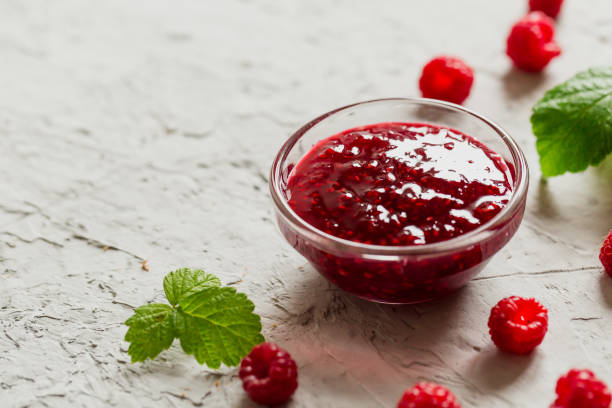 istock homemade raspberry jam on a concrete background with fresh raspberries, selective focus 1316599094
