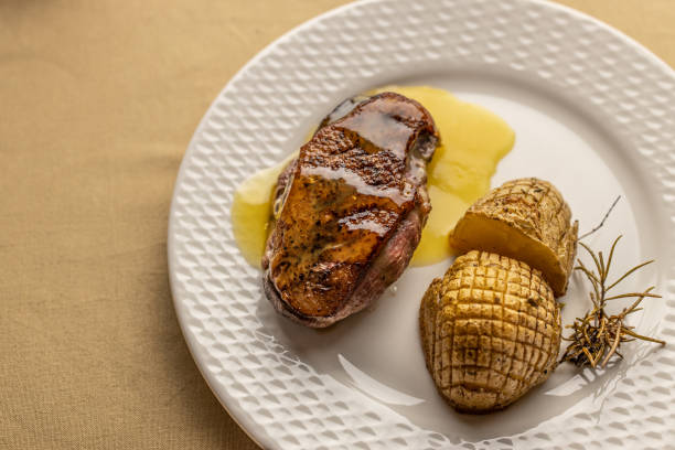 istock Duck breast with orange sauce and potatoes 1316600245
