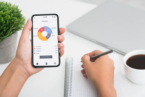 istock Unrecognizable woman counting spandings, using mobile app 1316601755