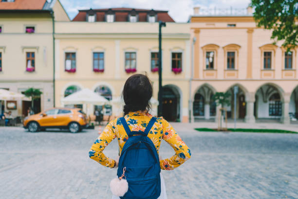 Rear view of tourist woman visiting Slovakia