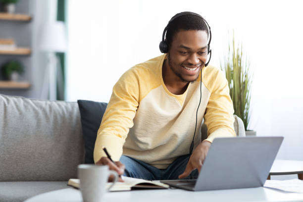 istock Positive black guy attending online training from home 1316604290