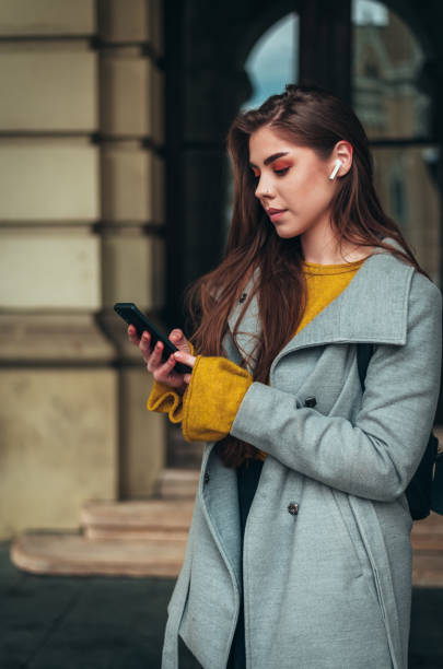 istock Young beautiful woman using a smartphone 1316605140