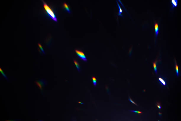 istock colorful warm rainbow crystal light leaks on black background 1316607545
