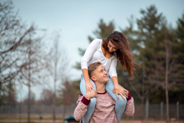Young love couple is hugging each other in nature