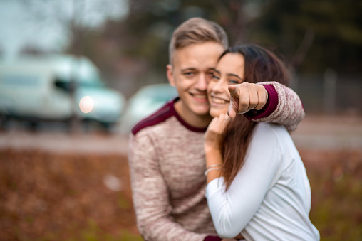 Young love couple is hugging each other in nature