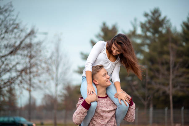 istock Boyfriend is carrying his girlfriend on his shoulders 1316612313
