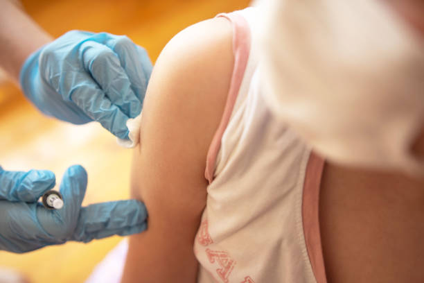 istock Girl getting a vaccine. 1316616897