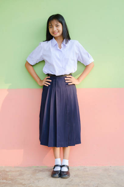 Portrait student young girl in uniform school.