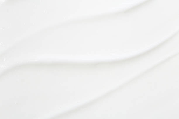 istock White lotion swatch isolated on white. Cosmetic liquid cream tex 1316619093