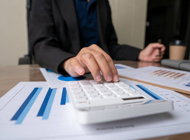 istock bookkeeper or financial inspector hands making report, calculating or checking balance. Home finances, investment, economy, saving money or insurance concept 1316621849