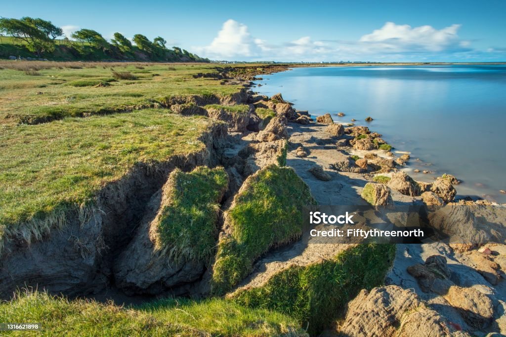 Morecambe Bay Coastal Erosion Morecambe Bay coastal erosion.  High Tide, long exposure.  Carnforth, Lancashire. Morecambe Stock Photo