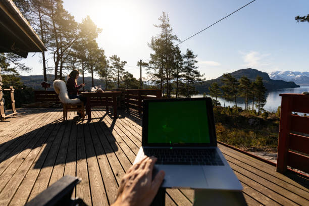 istock POV smart working in a majestic resort: devices with green screen chroma key 1316621911
