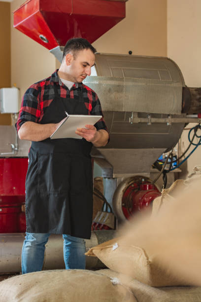 istock Worker is working in coffee roaster shop factory 1316623281