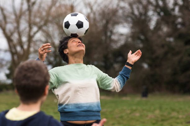 istock Mature Woman Balancing a Ball on Her Head 1316625000