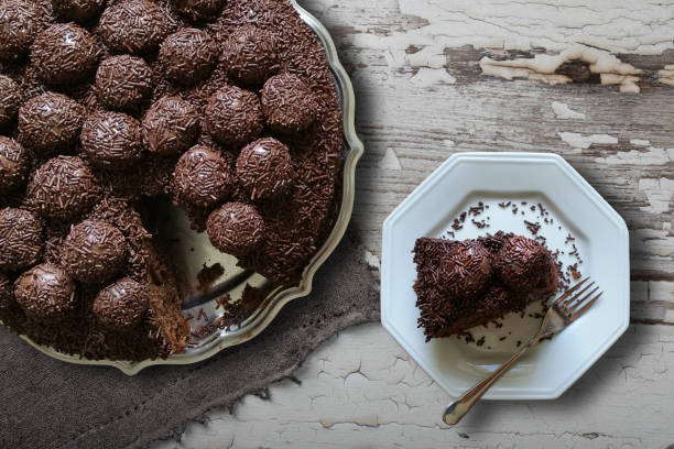 istock Brazilian Brigadier cake with cut piece on the plate 1316626586