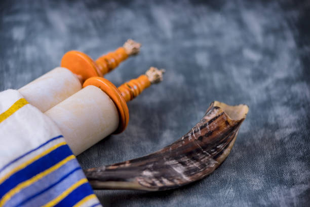 istock Prayer shawl in shofar horn on soft focus Jewish torah scroll 1316626665