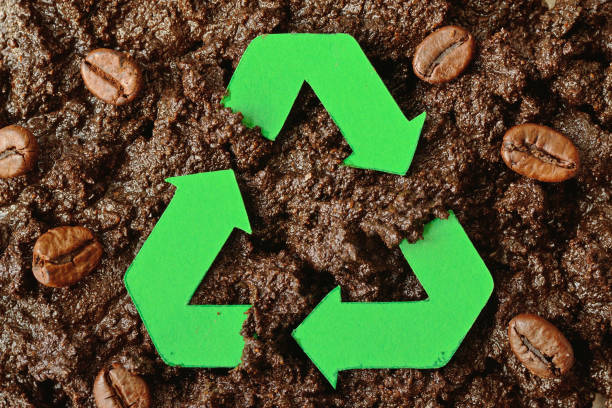 Recycling symbol on coffee grounds - Concept of ecology and recycling stock photo