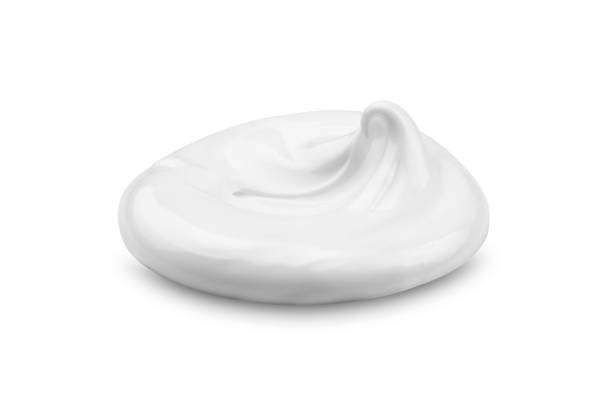 istock Beautiful curl of cream on a white background 1316628267