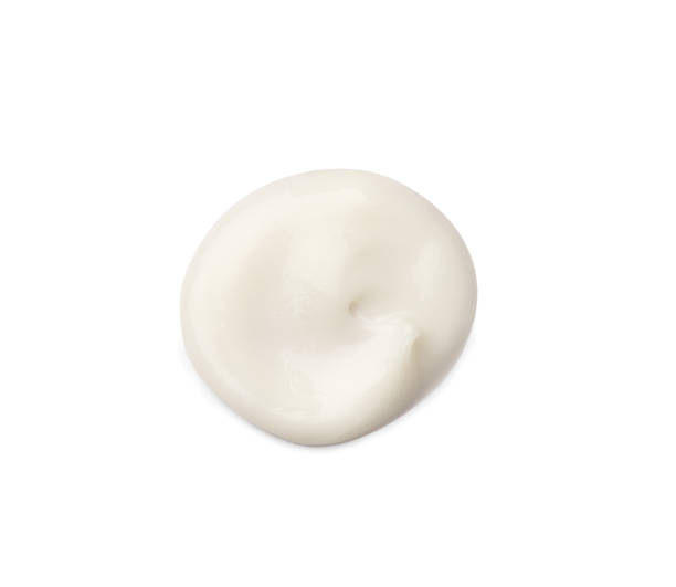 istock Cosmetic cream drop on white background 1316628314