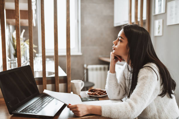 istock Female Writer Thinking About Inspiration And making Manuscript For New Work During Pandemic 1316630025
