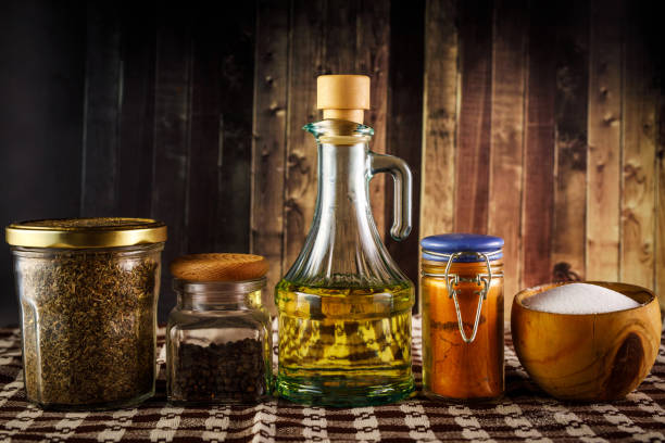 istock The set of spices and oil on a rustic wooden background. 1316632081