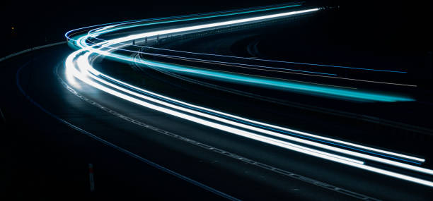 istock lights of moving cars at night. long exposure 1316632573