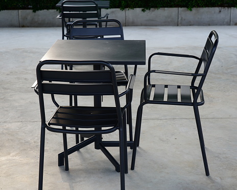 Outdoor Set of table and chairs on floor of cafe