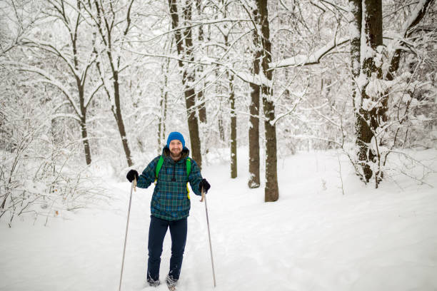 istock Man hiking on snow in mountains 1316638224