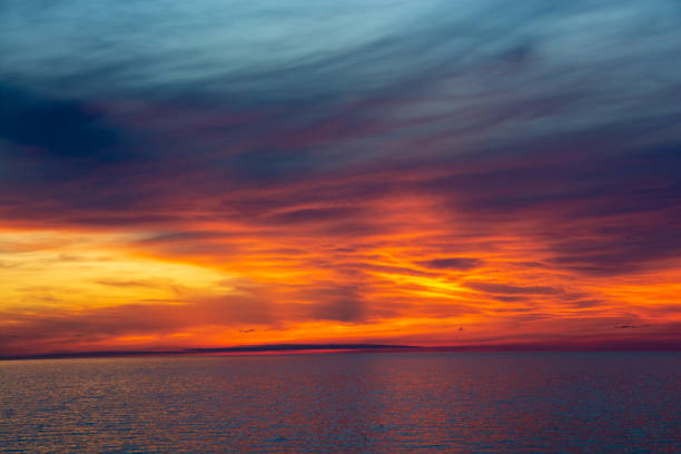 istock Beautiful dusk sea and orange sky 1316638679