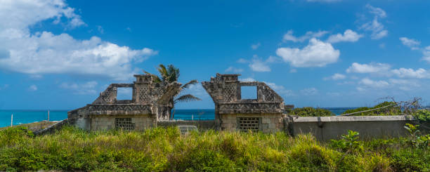 Ancient ruins on Isla Mujeres, Cancun, Mexico with beautiful blue sky with clouds in background