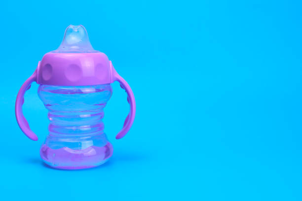 istock baby bottle isolated on blue background 1316642666