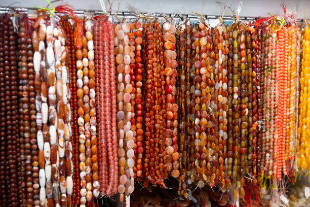 istock Strands of semiprecious stones on display in bijouterie store 1316643327