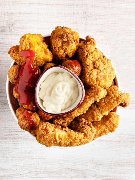 istock Fried Chicken Strips, Fingers and Drumstick, Crispy fried breaded chicken strips, 1316643343
