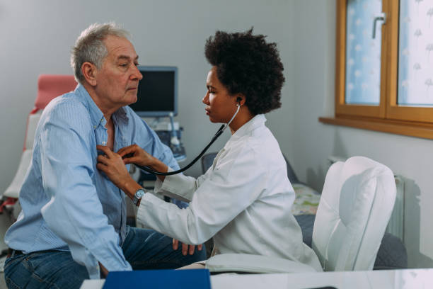istock Female doctor examining a senior patient 1316644578
