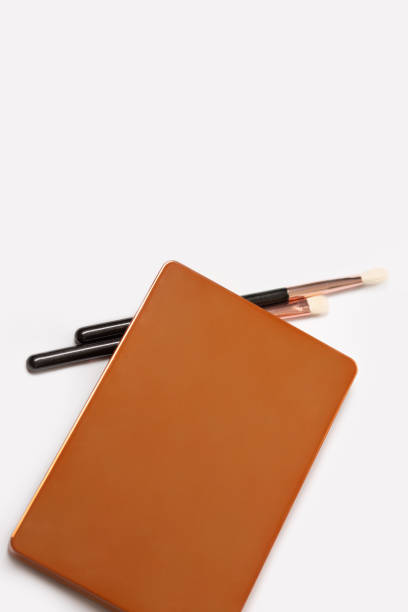 istock Closed eye shadow palette in golden case with brushes 1316645848
