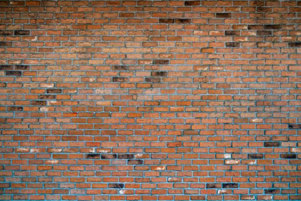 istock Brick wall wallpaper texture clinker and concrete pattern in old vintage red and brown colour theme under the constuction area 1316646040