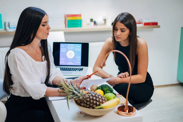 istock Professional dietologist explaining to her patient her test result ad helping her to understand her glucose intolerance and how to start with her new dieting program 1316646440