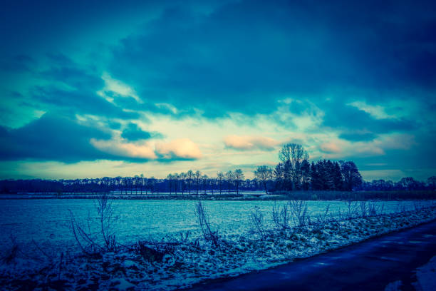 istock A field in the snow evening next to a road in Germany. 1316649144