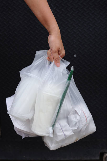 istock Plastic Polution. Every day they used more plastic bag and Coffee mug is Single used Plastic. Hand hold Plastic Waste 1316649952