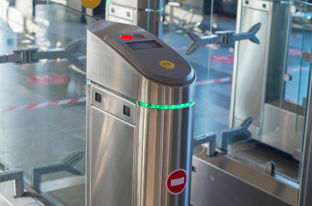 istock Turnstile for entry and exit with tickets. Closed entrance turnstile with access denied red sign. Security barrier. Business leaders pass through the turnstile of the office gates. 1316651679